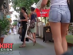 The cameraman was strolling around the city recording amateurs in the hot jeans shorts