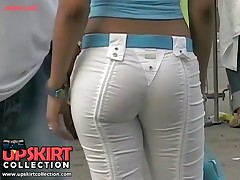 The charming bimbo in the denim hot pants of the white color was spied in the streets
